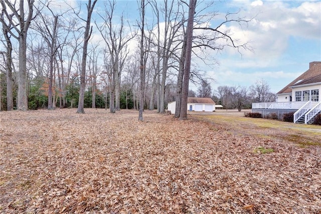 view of yard with a wooden deck