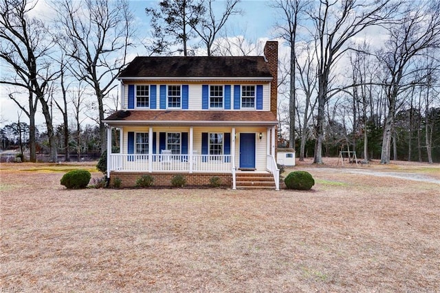 colonial inspired home featuring a porch