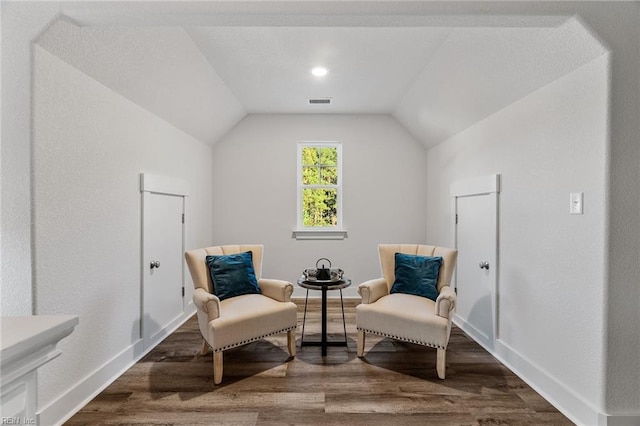 sitting room with vaulted ceiling and hardwood / wood-style floors