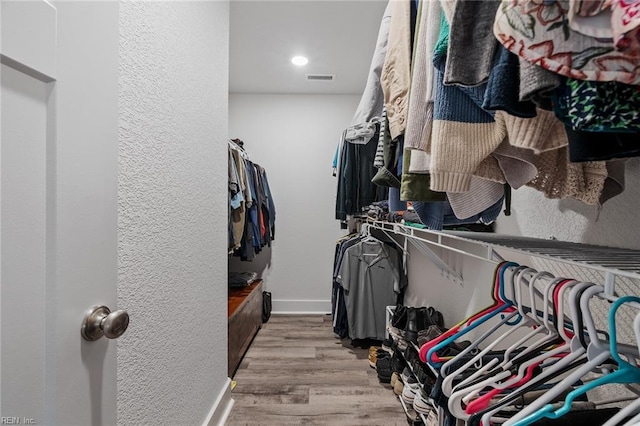 walk in closet featuring light wood-type flooring