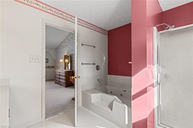 bathroom featuring independent shower and bath and a textured ceiling