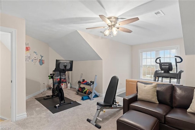 exercise area with lofted ceiling, light colored carpet, and ceiling fan