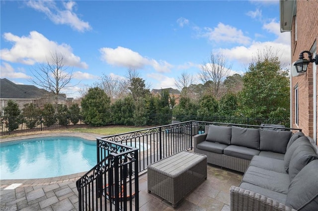 view of pool featuring an outdoor living space and a patio area