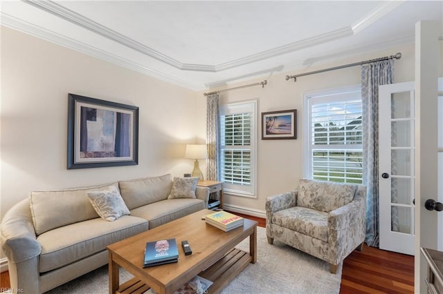 living room with crown molding and hardwood / wood-style floors