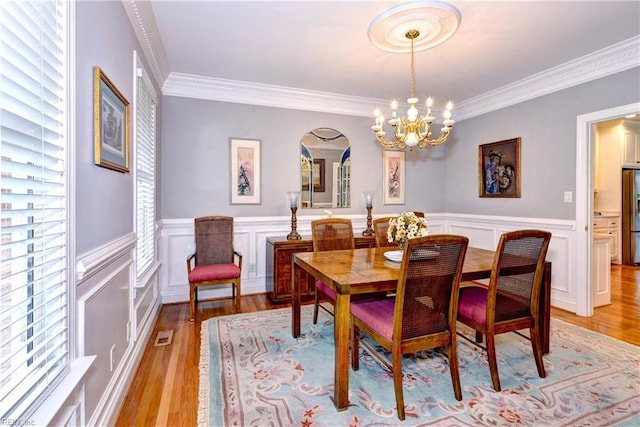 dining room with plenty of natural light and light wood-type flooring