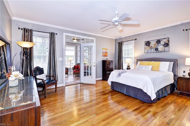 bedroom featuring french doors, wood-type flooring, crown molding, and access to exterior