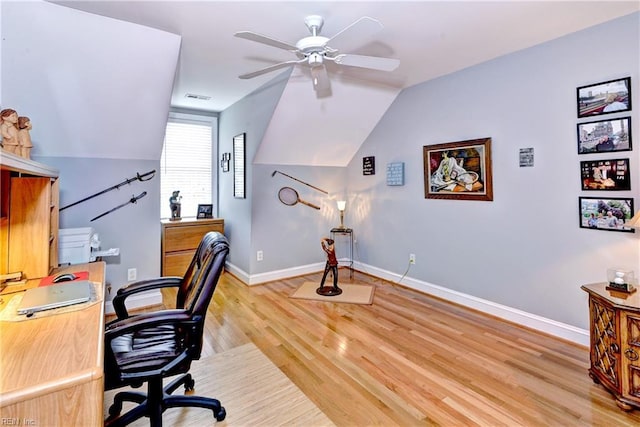 office space featuring lofted ceiling, ceiling fan, and light hardwood / wood-style flooring