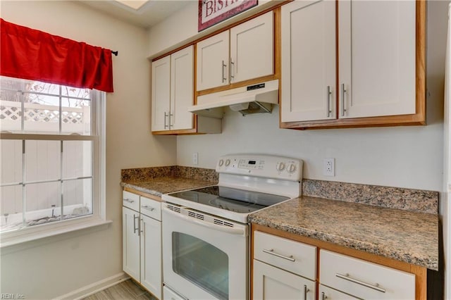 kitchen featuring white cabinetry, white electric stove, and stone counters