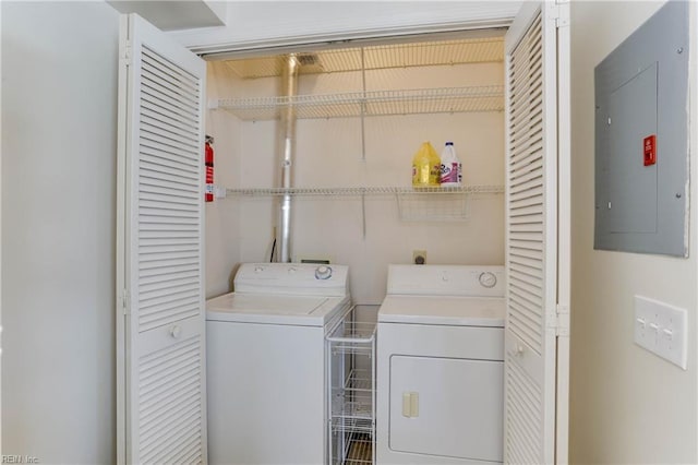 laundry room featuring washer and dryer and electric panel