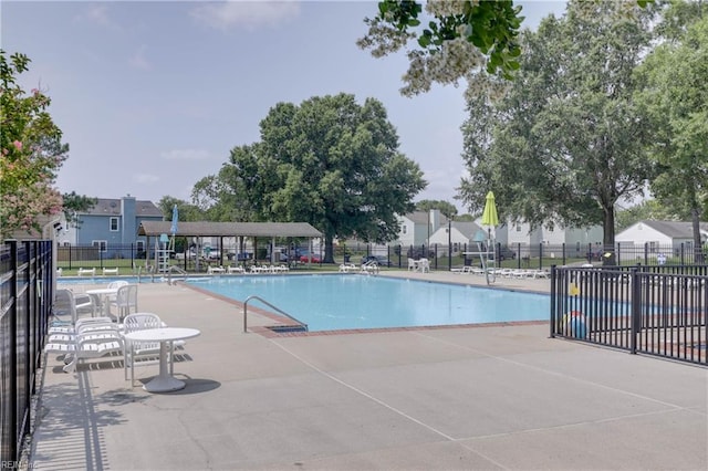 view of swimming pool with a patio