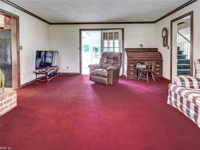 living area featuring ornamental molding and carpet flooring