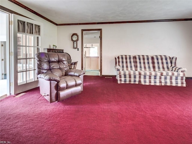 carpeted living room featuring ornamental molding