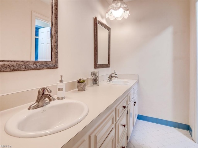 bathroom featuring tile patterned flooring and vanity