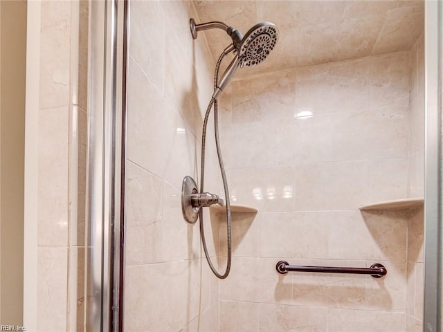 interior details with a tile shower