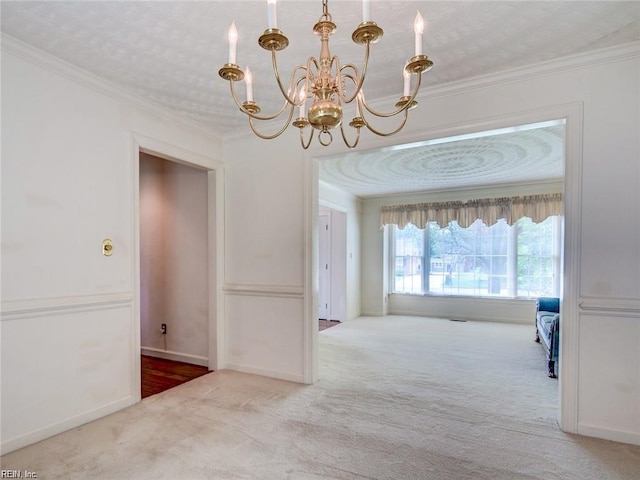 interior space with ornamental molding, light colored carpet, and a chandelier