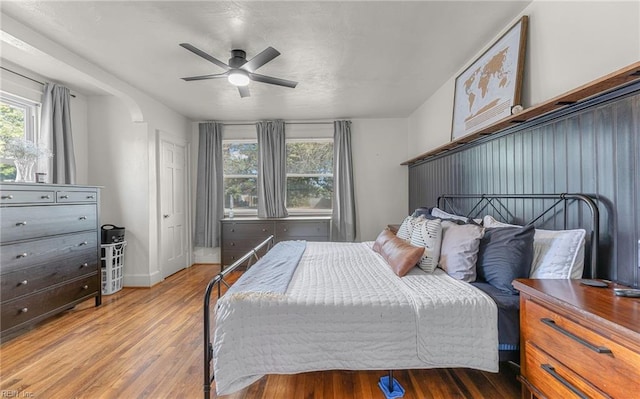 bedroom with hardwood / wood-style flooring and ceiling fan