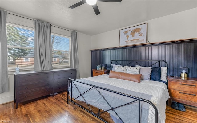 bedroom with hardwood / wood-style flooring and ceiling fan