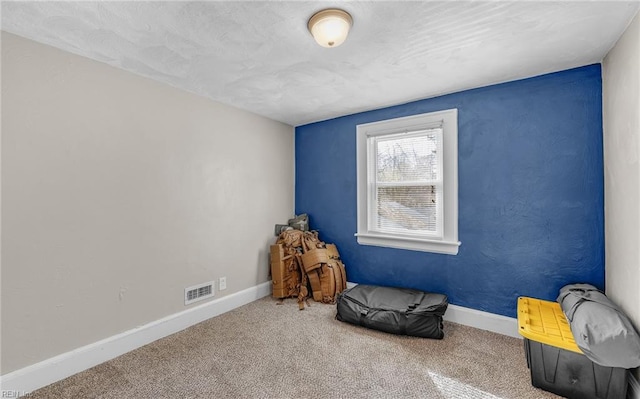 living area with carpet flooring