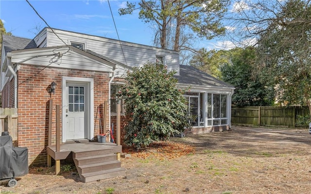 view of front of house with a sunroom