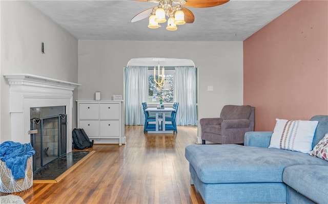 living room featuring hardwood / wood-style flooring and ceiling fan