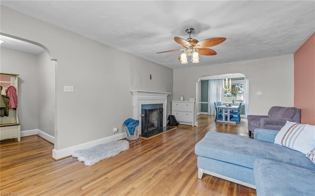 living room featuring hardwood / wood-style flooring and ceiling fan