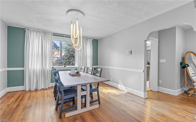 dining space featuring hardwood / wood-style flooring