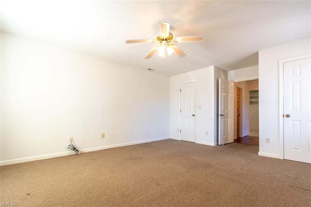 unfurnished bedroom featuring ceiling fan and carpet floors