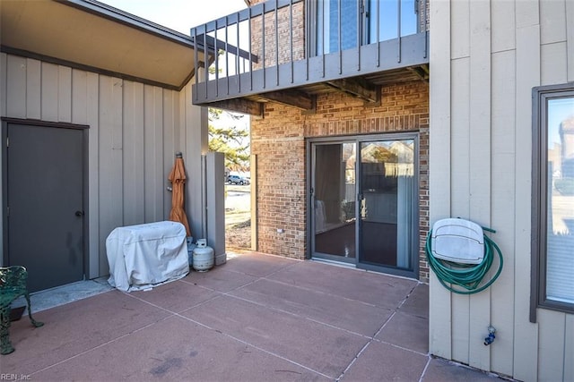 view of patio featuring a balcony