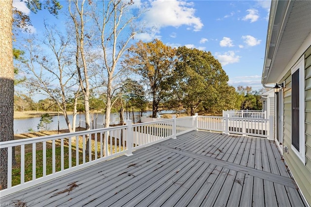 wooden deck with a water view