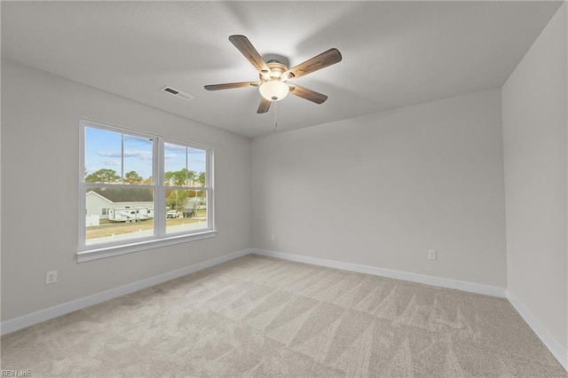 carpeted empty room with ceiling fan