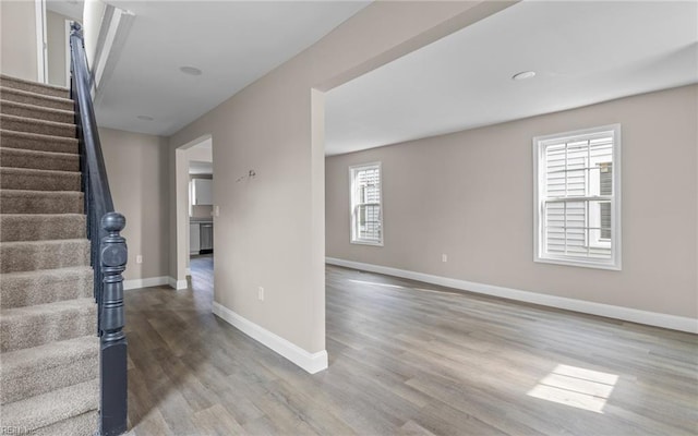 staircase featuring hardwood / wood-style flooring