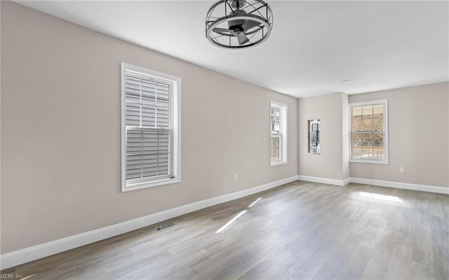 spare room featuring light hardwood / wood-style flooring