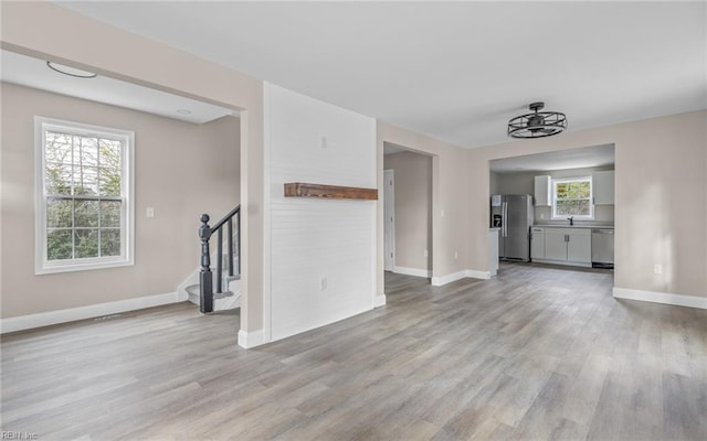 unfurnished living room featuring light hardwood / wood-style flooring