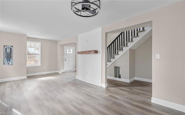 unfurnished living room featuring light hardwood / wood-style floors