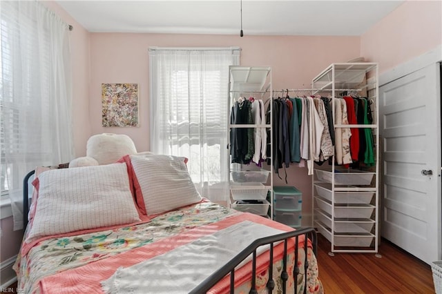 bedroom featuring dark hardwood / wood-style flooring