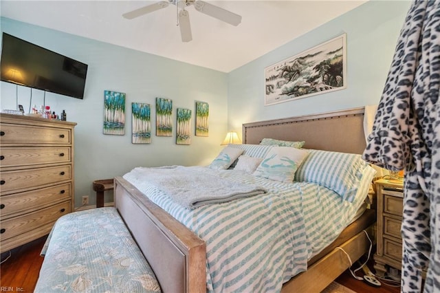 bedroom with ceiling fan and dark hardwood / wood-style flooring