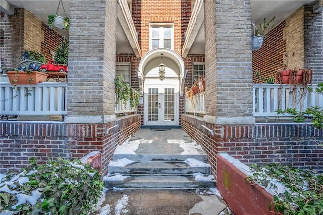 property entrance featuring french doors and covered porch