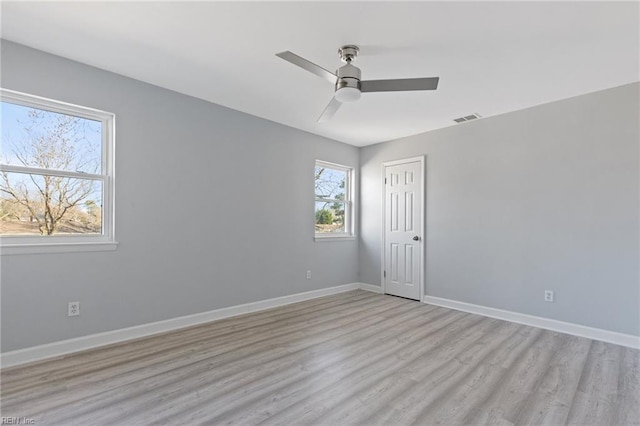 unfurnished room featuring light hardwood / wood-style flooring and ceiling fan