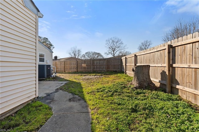 view of yard with central AC unit