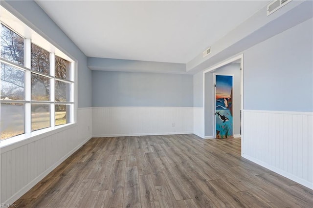 spare room with wood-type flooring