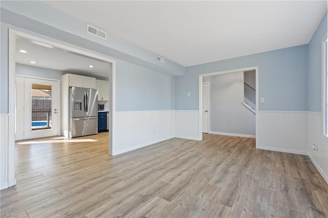 unfurnished room featuring light hardwood / wood-style floors