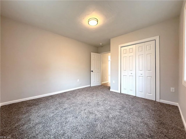 unfurnished bedroom with carpet flooring and a closet