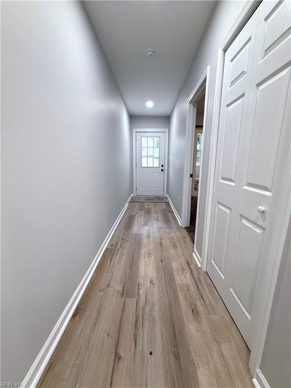 hall with light wood-type flooring