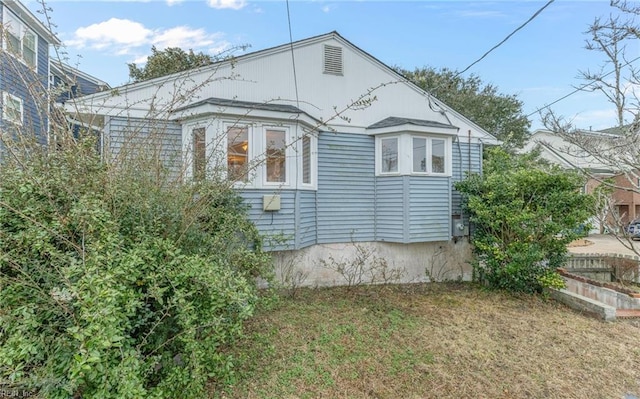 view of home's exterior featuring a lawn