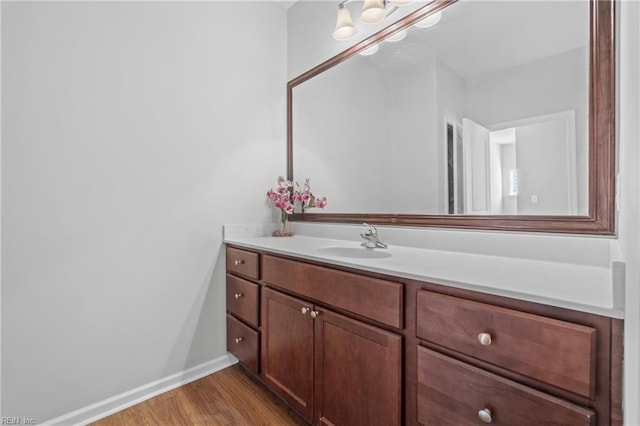 bathroom with vanity and wood-type flooring