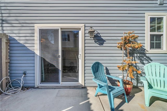 entrance to property featuring a patio