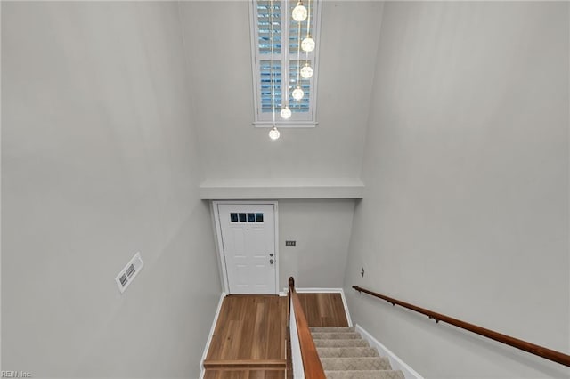 stairway featuring hardwood / wood-style floors