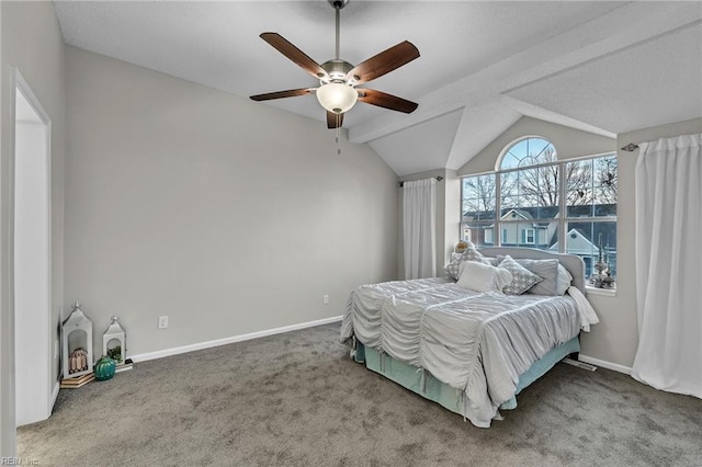 bedroom featuring ceiling fan, vaulted ceiling, and carpet