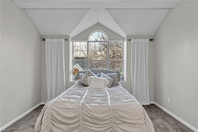 bedroom featuring vaulted ceiling and carpet floors