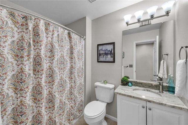 bathroom featuring vanity, a notable chandelier, and toilet